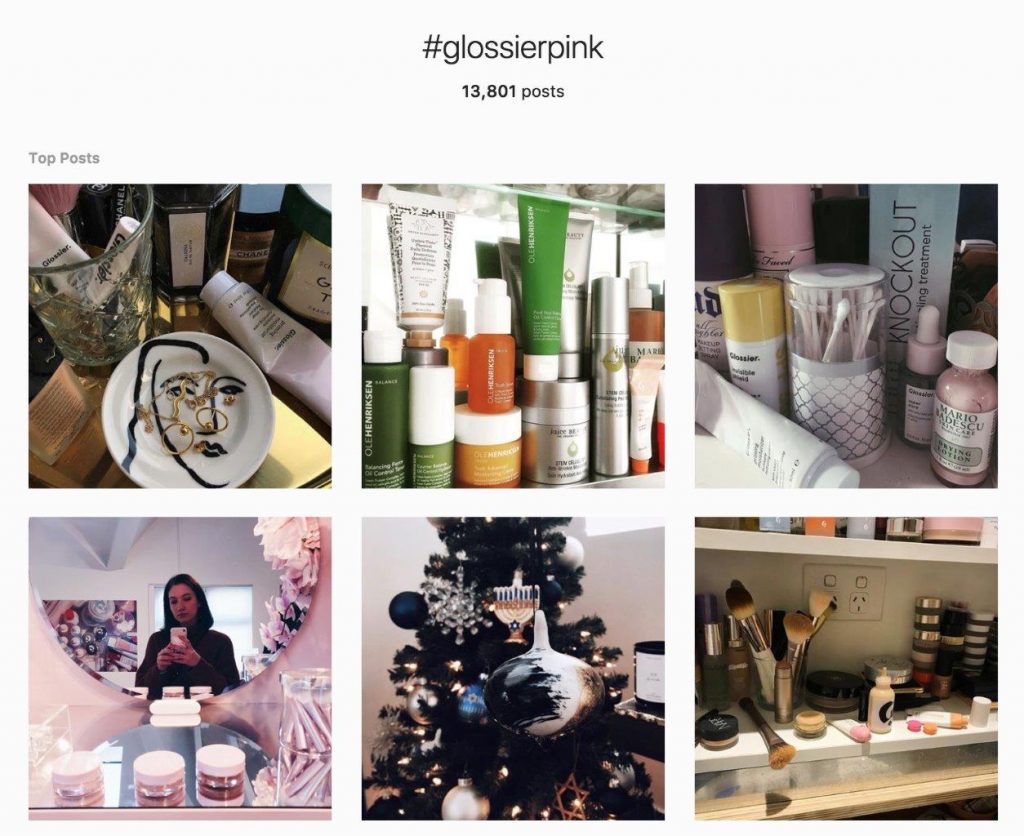 Instagram feed with fan photos of Glossier pink color