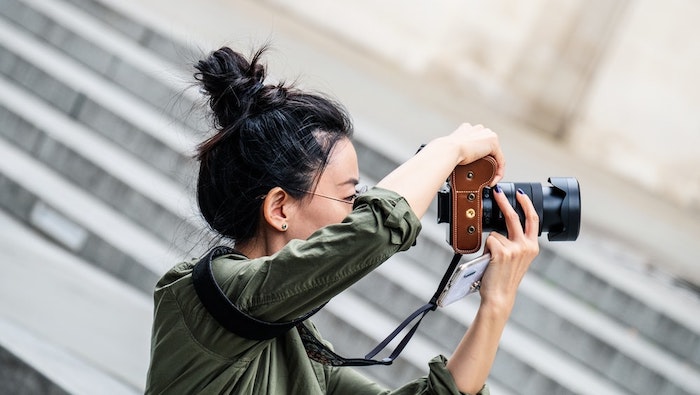 Woman Photographer Taking Phots by Stairs