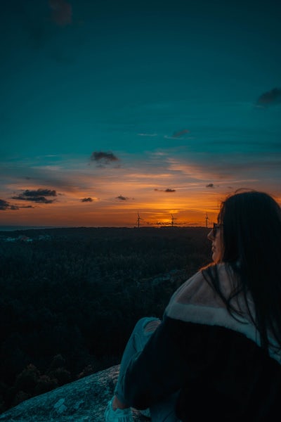 Girl Sitting Watching Sunset