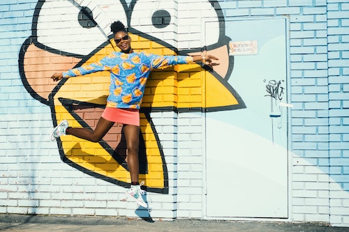 Young Millennial Woman Jumping in the Air